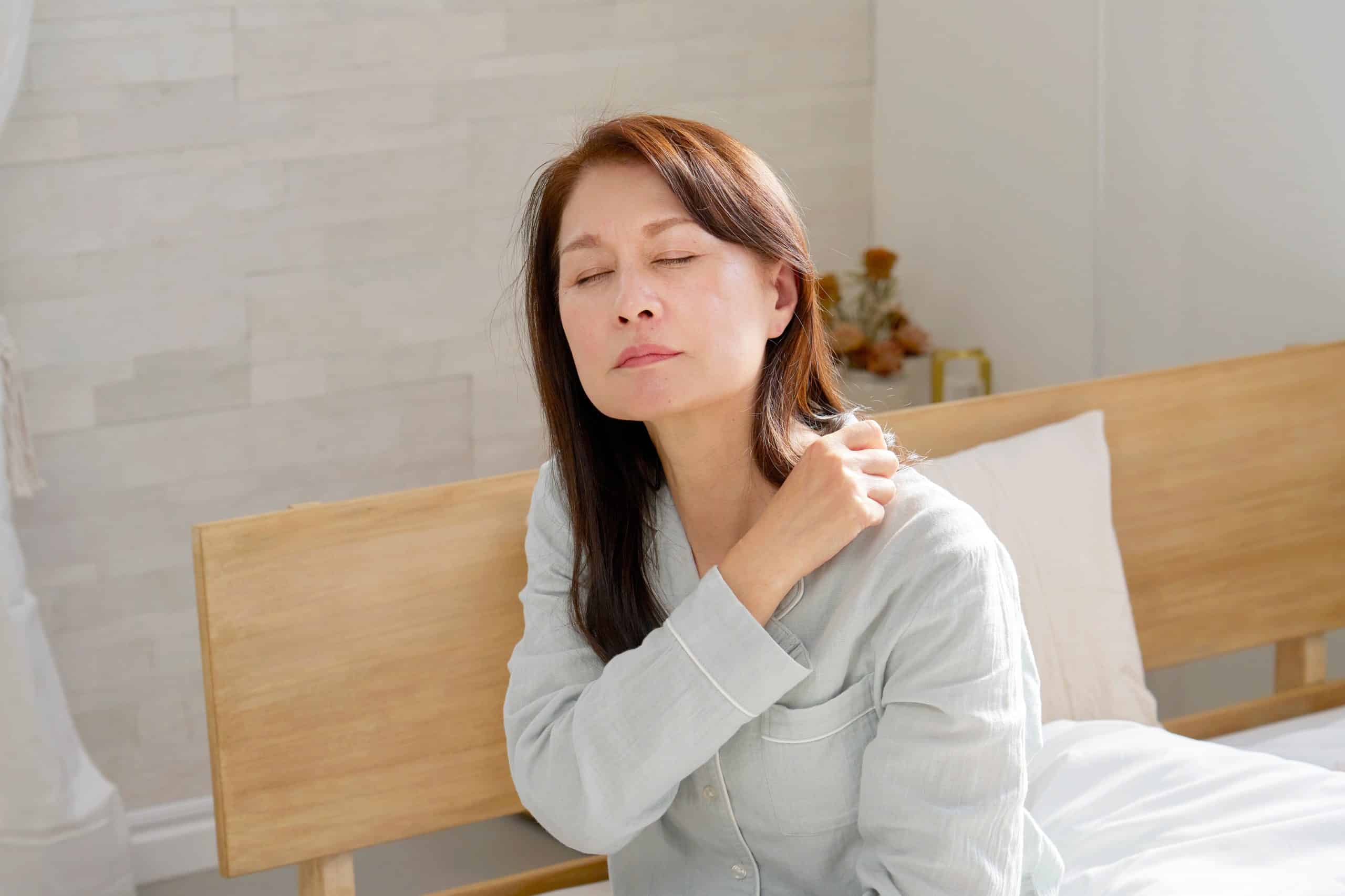 Osteopath gently assessing a patient's frozen shoulder at Tim Wood Healthcare clinic in Maidstone